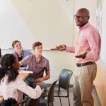 Black male teacher speaking to students