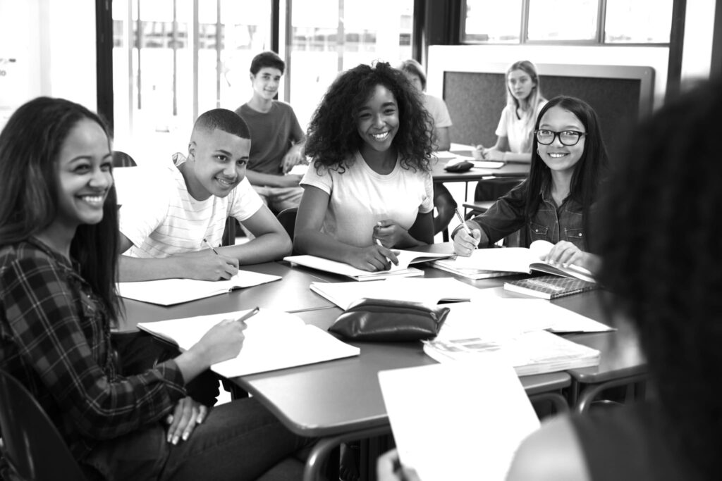 Group of high school students working on an assignment together