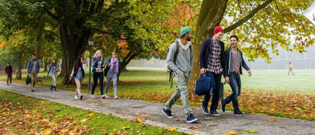 University students having fun while walking in campus