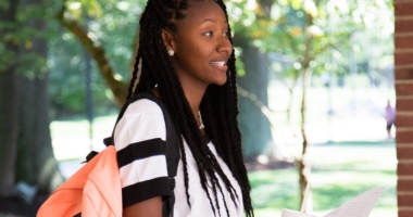 Black female college student with backpack