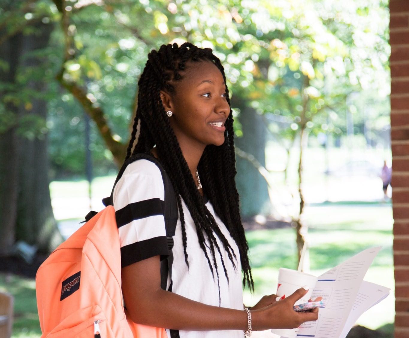 Black female college student with backpack