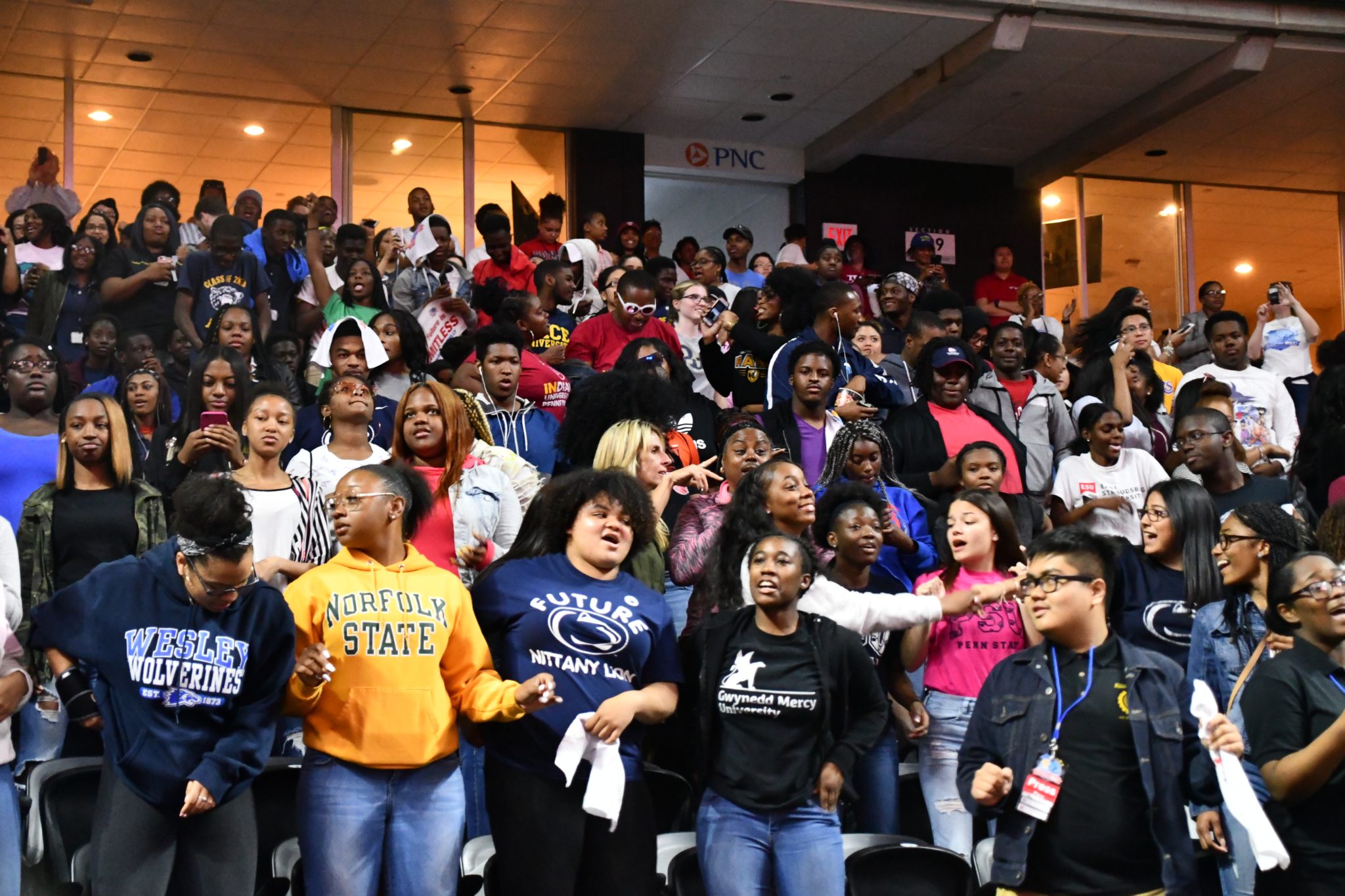Students cheering at college signing day 2018 event