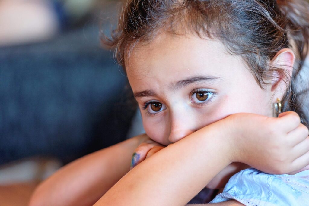 Little Latina girl looking worried