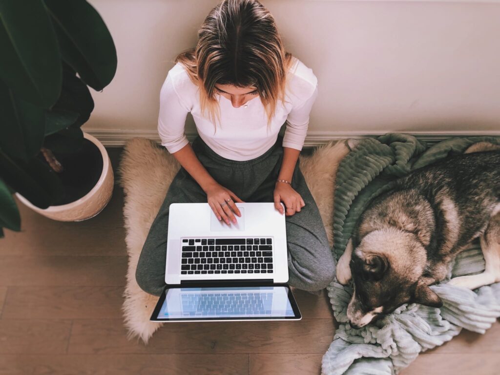 teenager working on a laptop computer
