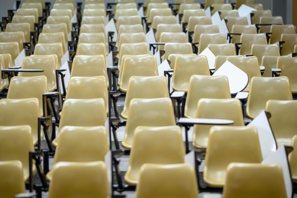 empty rows of seats in a school lecture hall