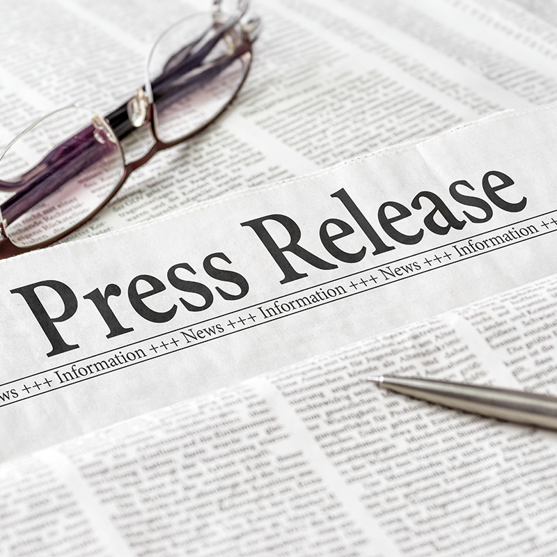 Press Release image of newspaper and eyeglasses