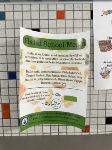 A sign describing halal certified cafeteria options