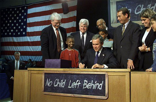 Visiting Hamilton High School in Hamilton, Ohio, Jan. 8, 2002, President George W. Bush signs into law the "No Child Left Behind Act."