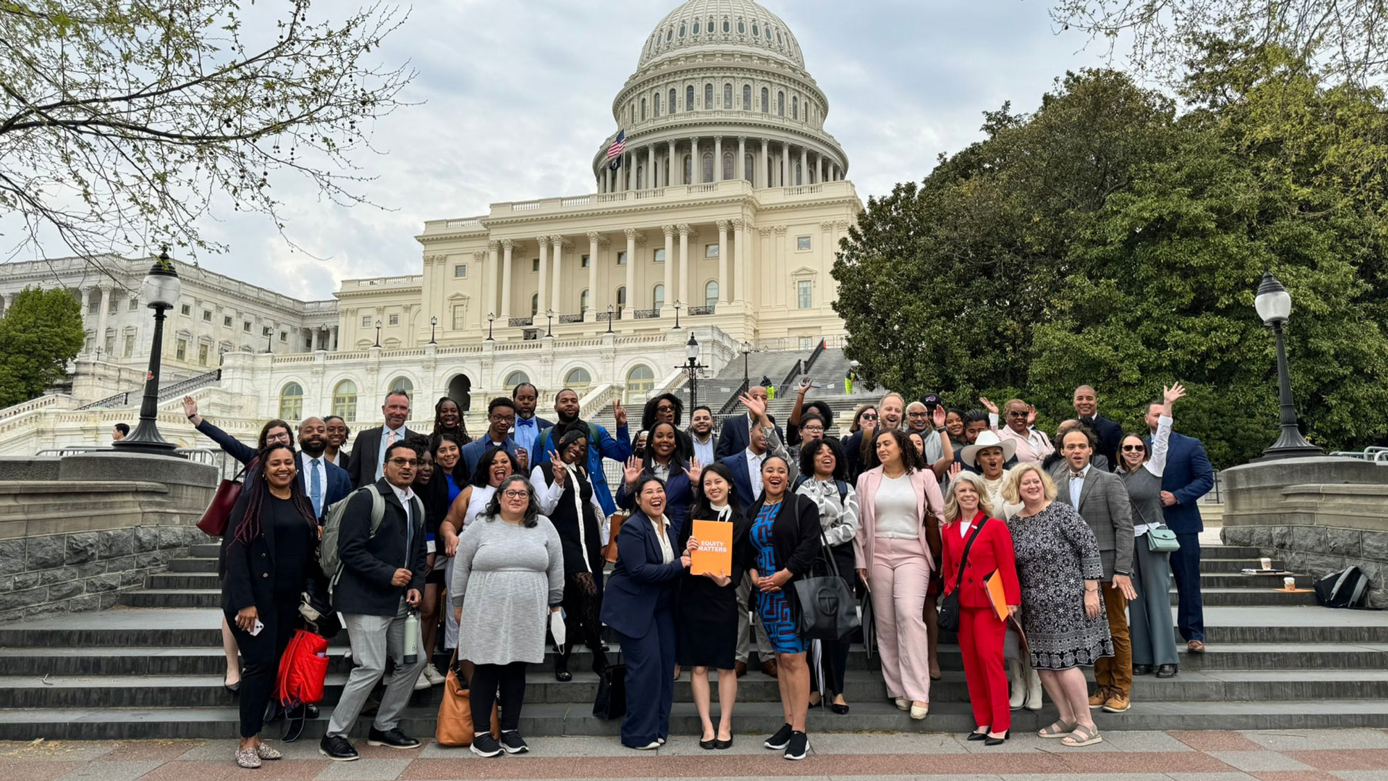 A group photo of advocates from Bootcamp in front of the United States Capitol building