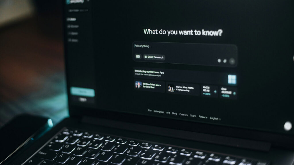 Artificial intelligence dashboard on a laptop screen asking What do you want to know