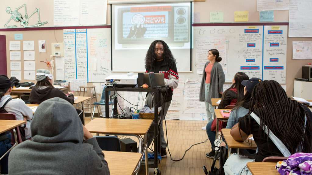 A student shares her research during a presentation in a psychology class.