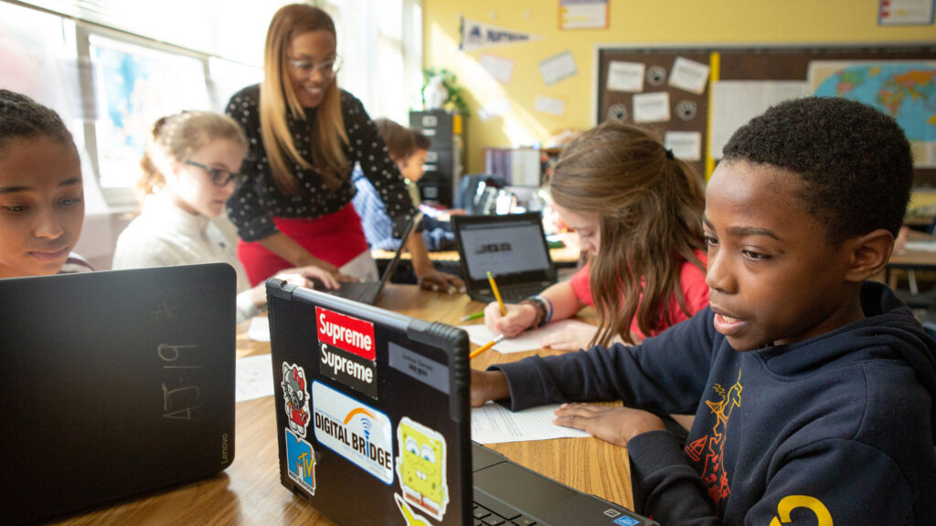 Students at Sutton Middle School use online research to answer questions during a lesson in history class.